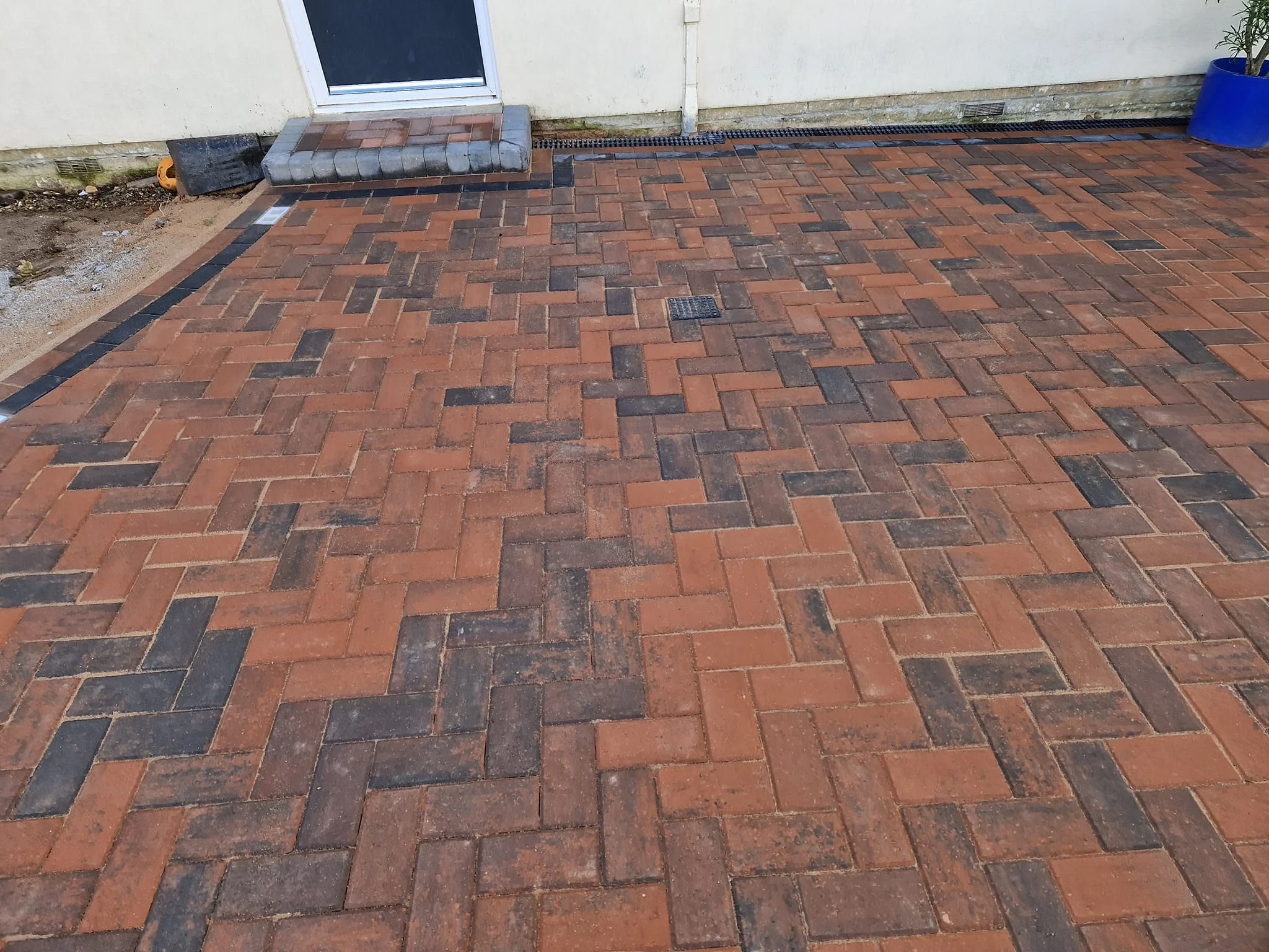 Brindle block paved driveway in a herringbone pattern