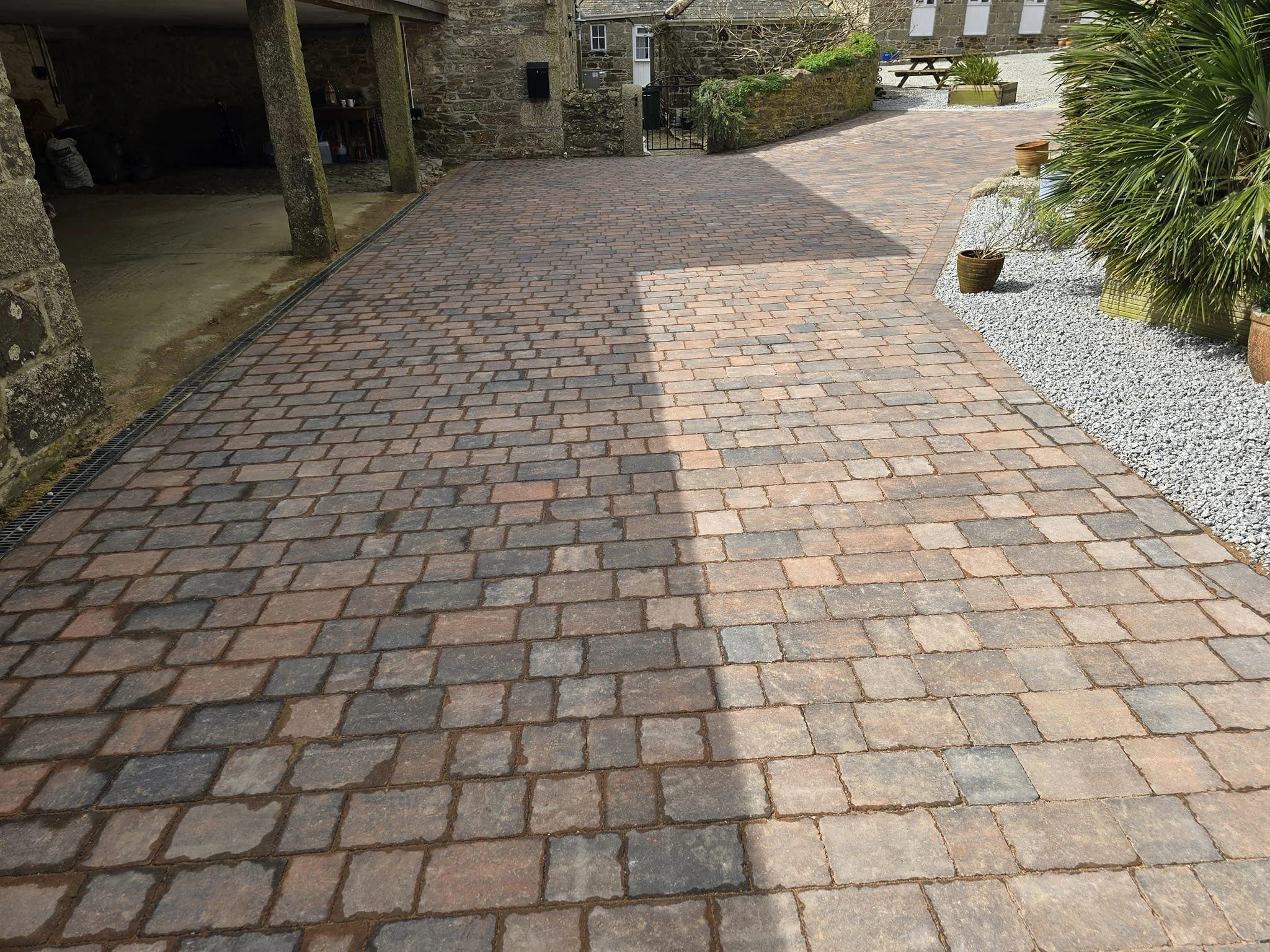 Cobble sett block paved driveway at a stone cottage