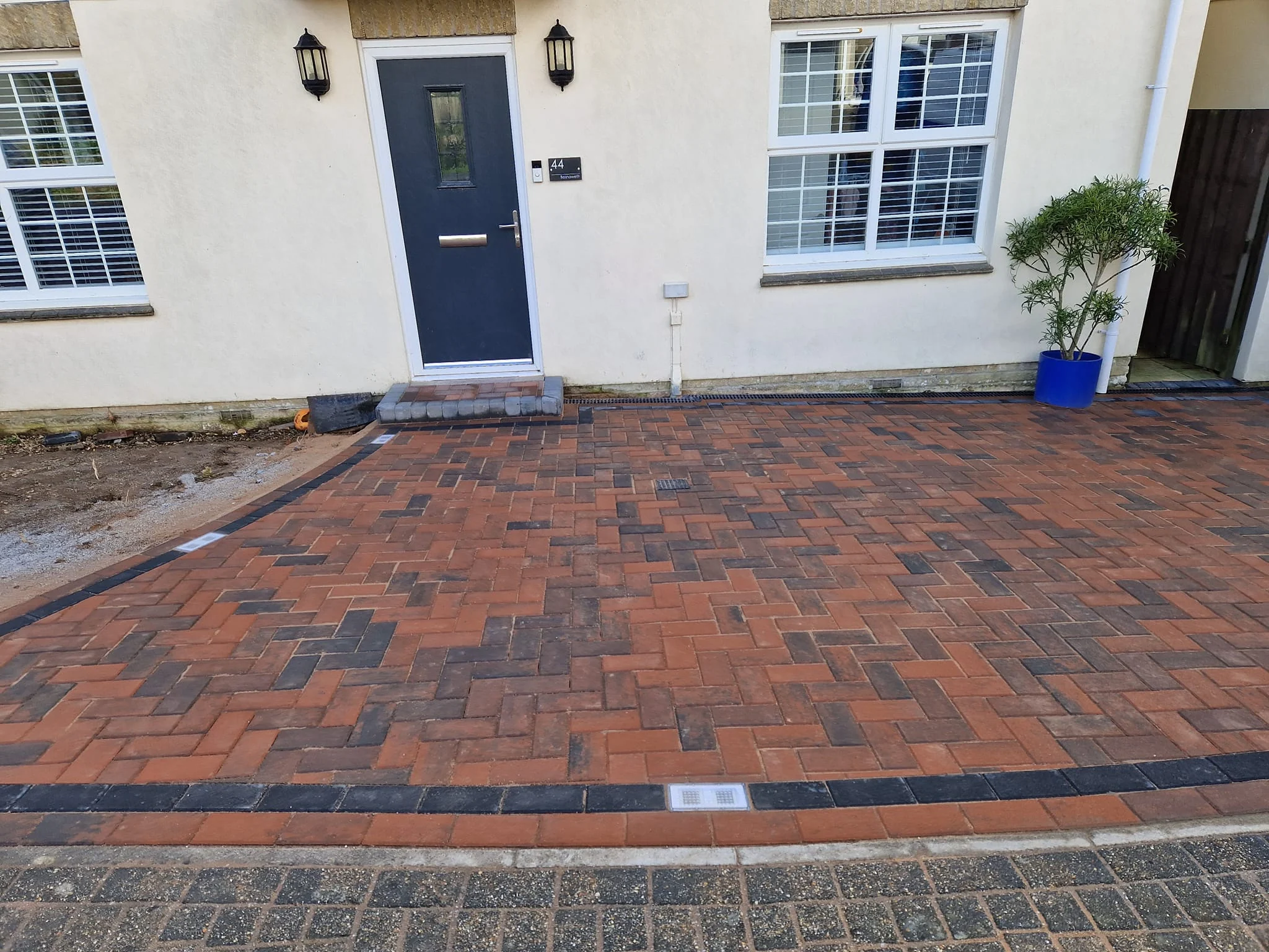Red brindle block paved front drive